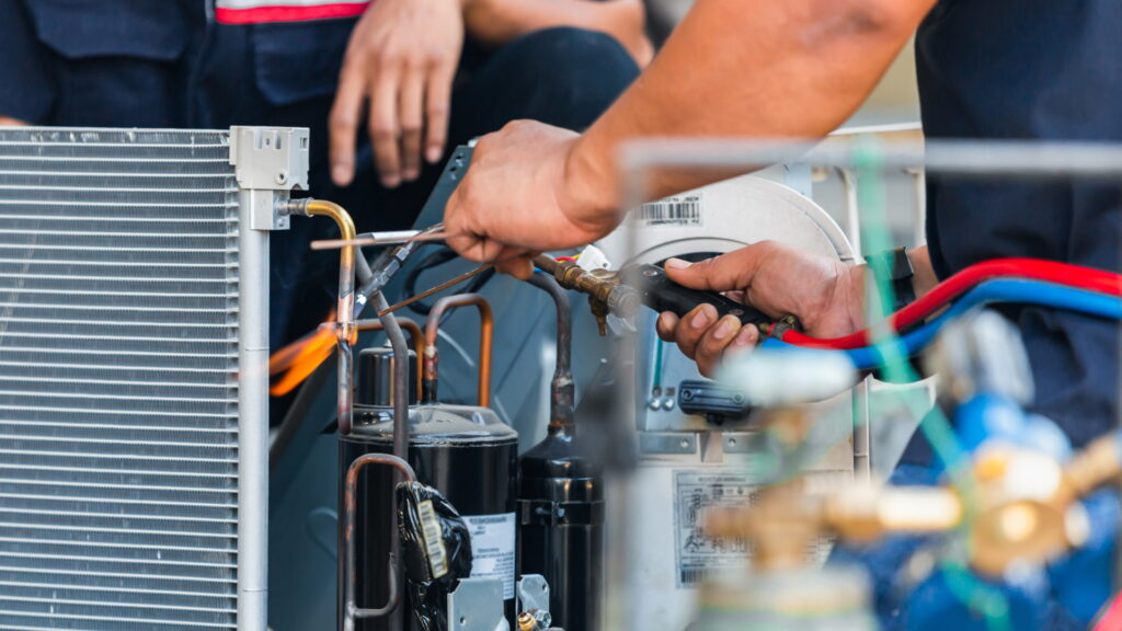 man repairing furnace